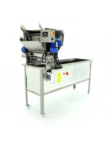 Uncapping machine with automatic feeder and holding tank, liquid heated knives